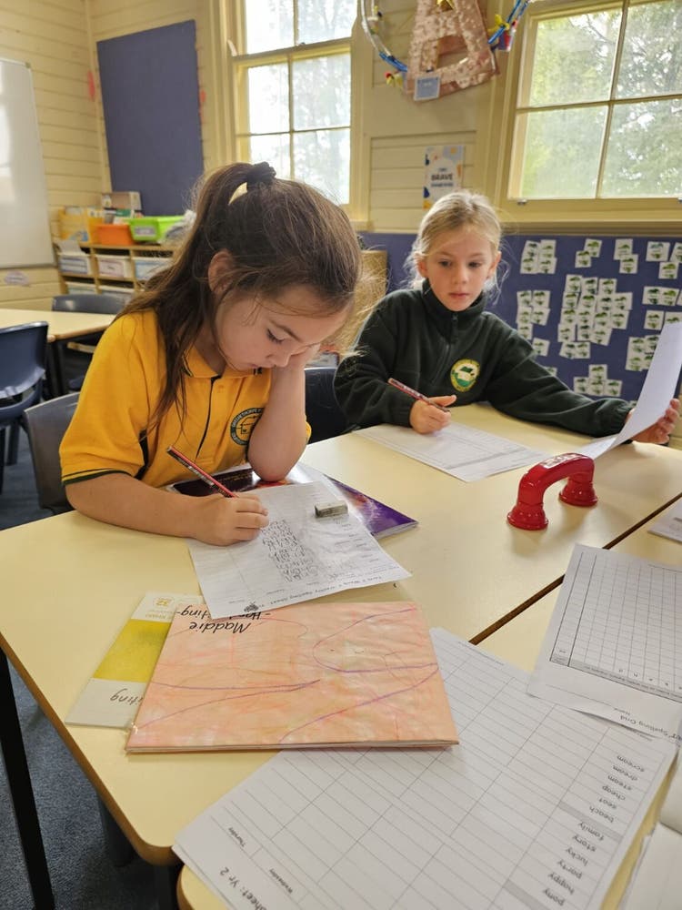 students working on their spelling at their desk