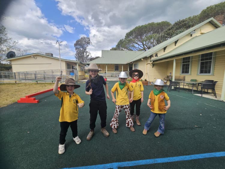 image showing students dressing in cowboy attire during performance rehearsal
